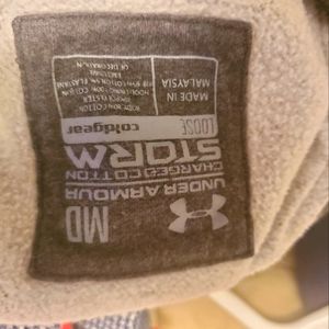 Under armour grey pull over hoodie. Size medium